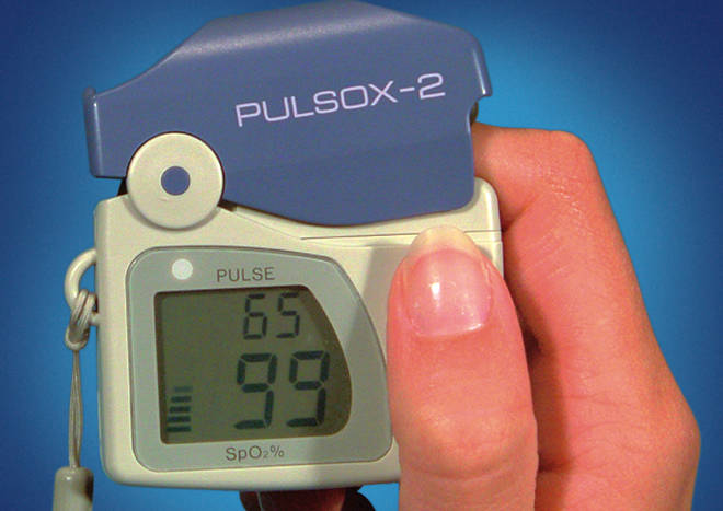 Pulse oximeter showing SpO2 99% and pulse 65 bpm
